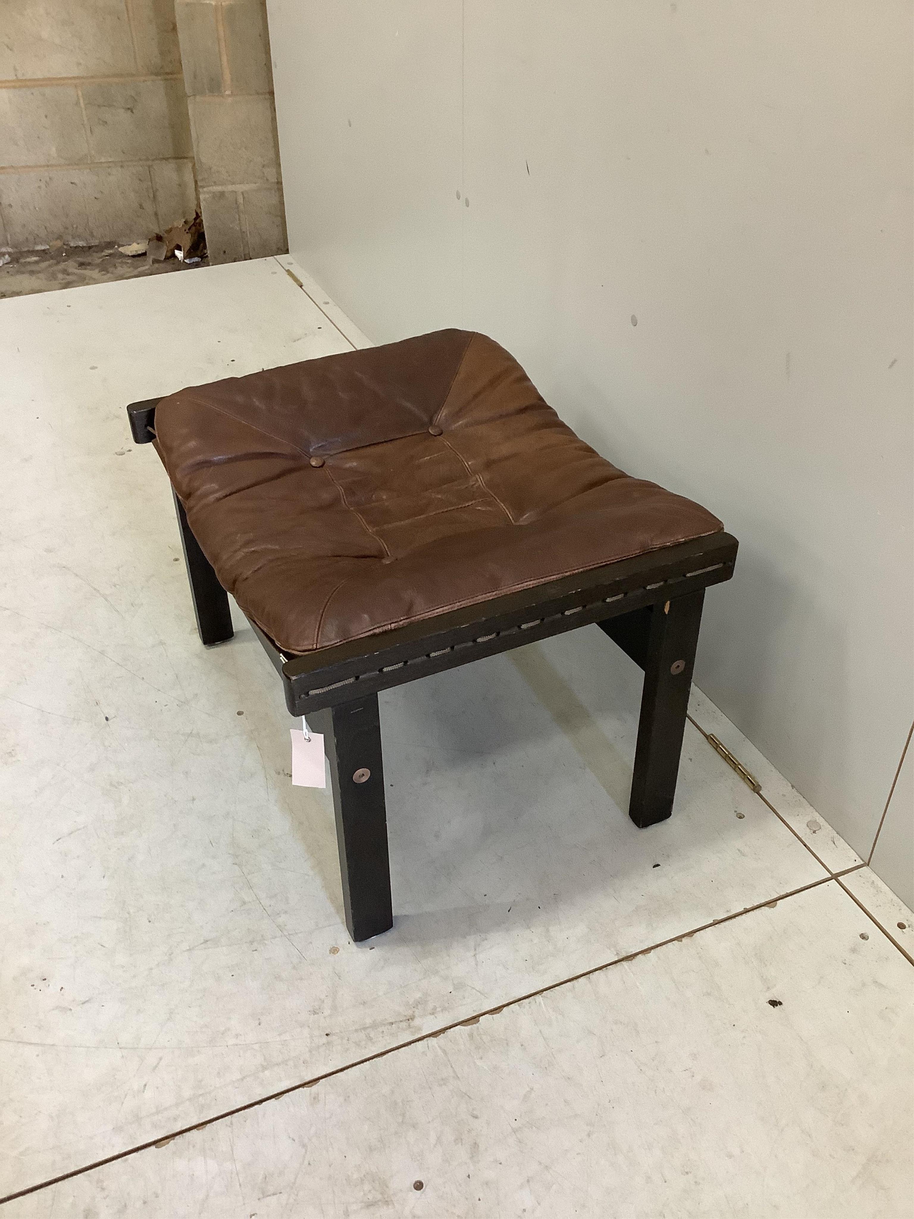 A Torbjorn Afdal 'Hunter' foot stool, width 63cm, depth 51cm, height 40cm. Condition - fair